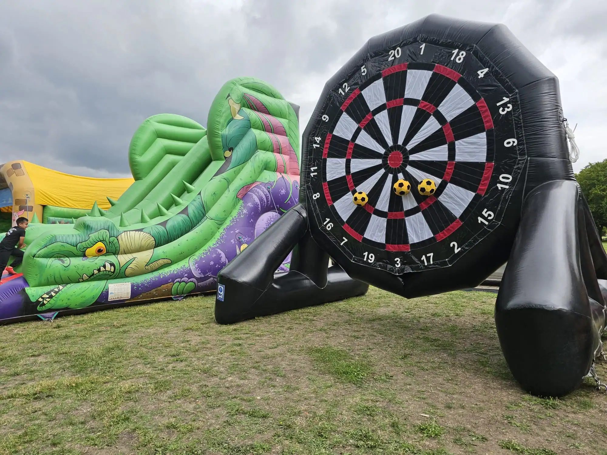SMH inflatable slide and football darts at an outdoor event