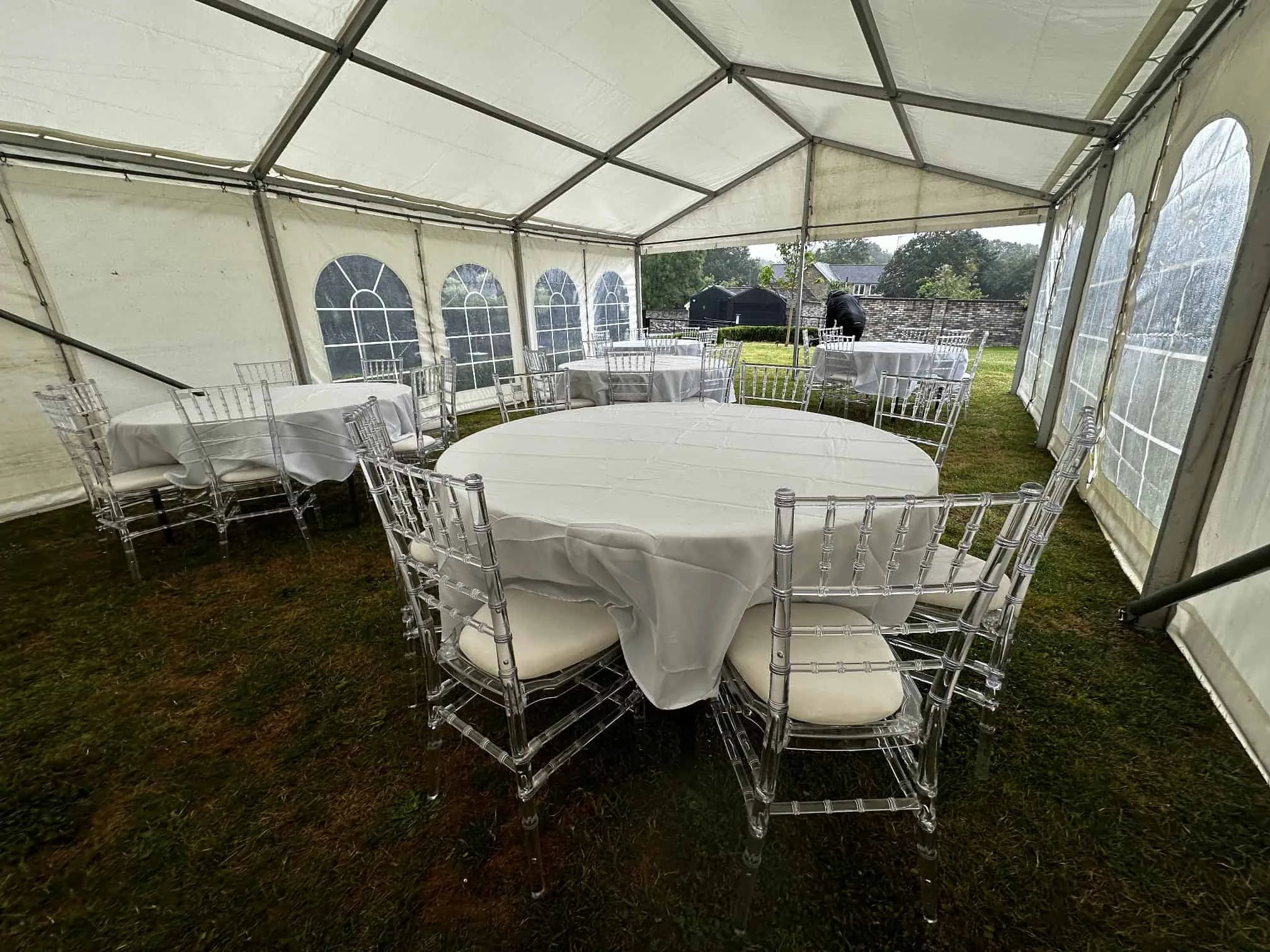 SMH marquee set up with round dining tables and Chiavari chairs