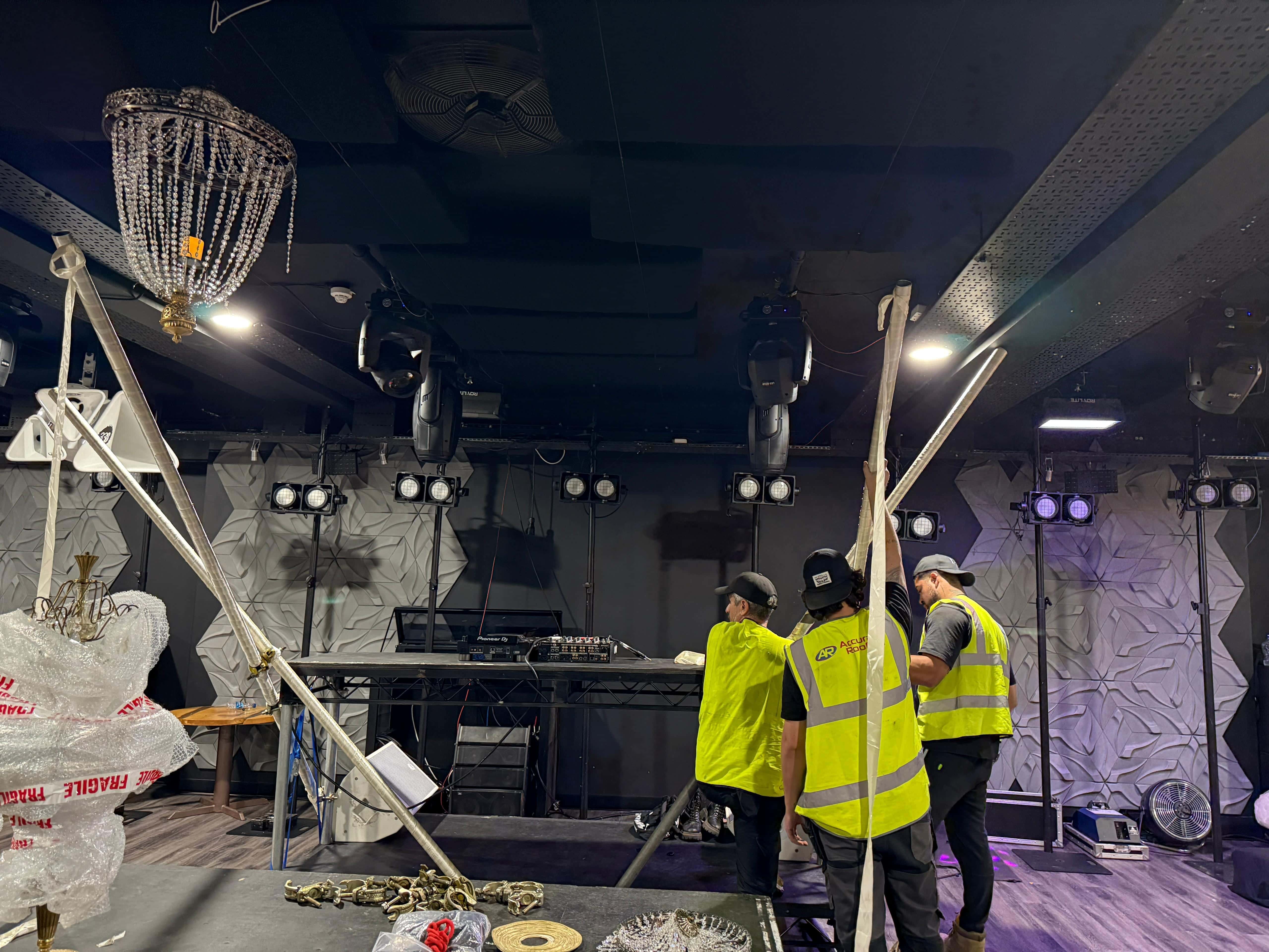 SMH crew working on an indoor event installation