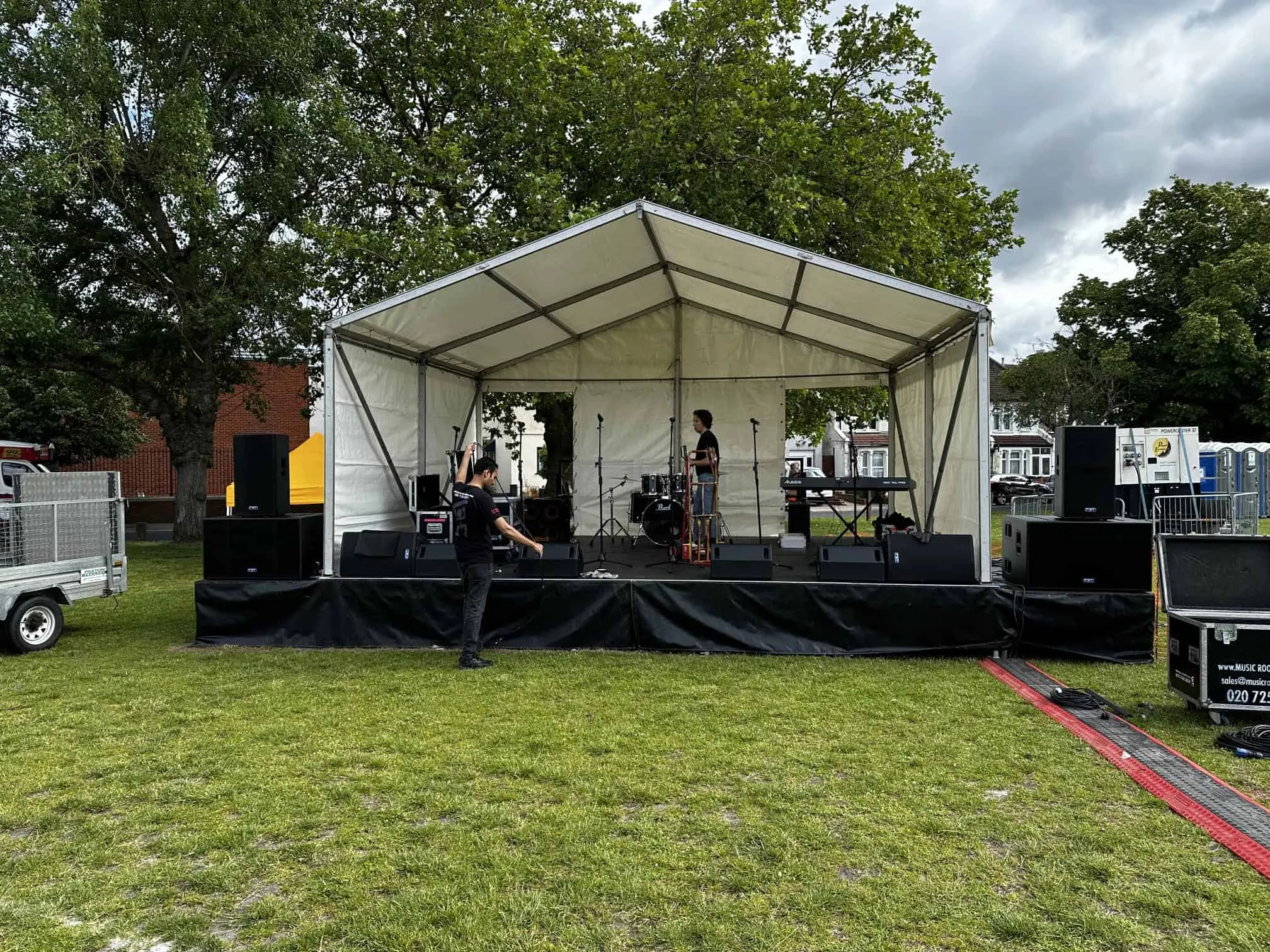 An SMH covered outdoor stage ready for a performance